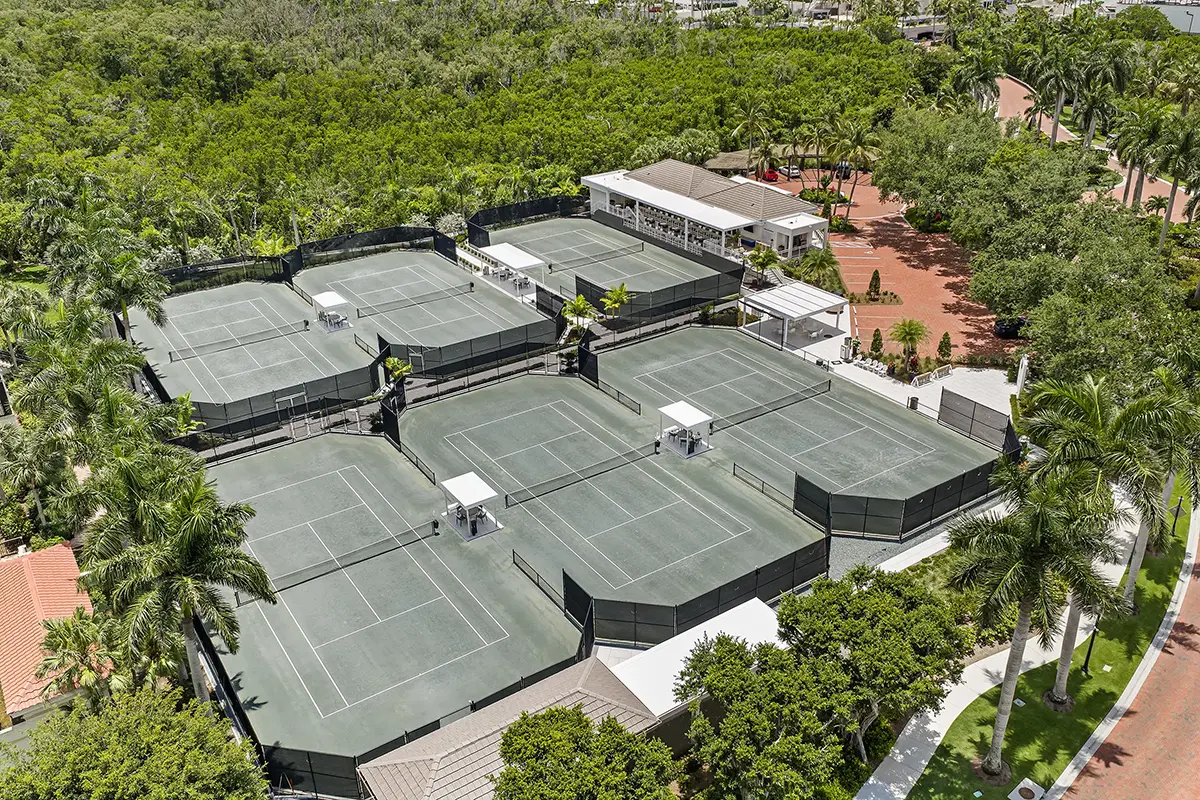 Aerial view of the Bay Colony Tennis Club's six hydro-clay courts with shaded seating and the clubhouse terrace, Naples, Florida