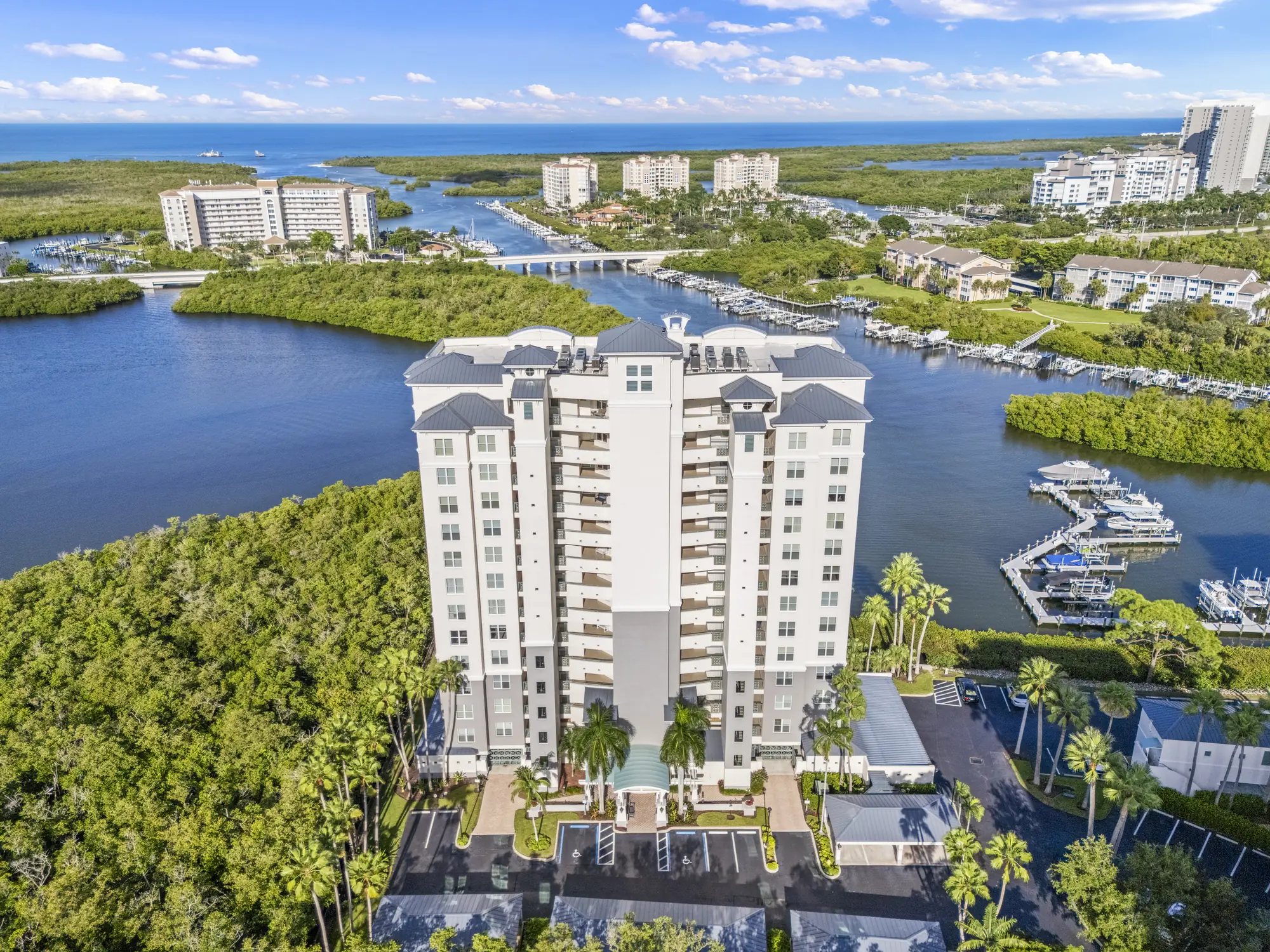 Aerial of Bequia at Cove Towers, 420 Cove Tower Drive, a high-rise beside the Wiggins Bay marina in North Naples, Florida