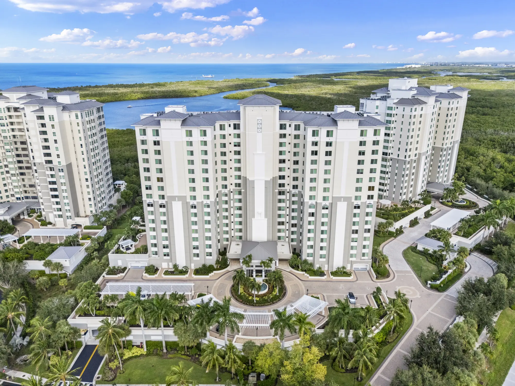 Aerial of Grande Phoenician, one of the four Grande Preserve towers at The Dunes of Naples, with Turkey Bay, the mangroves and the Gulf beyond