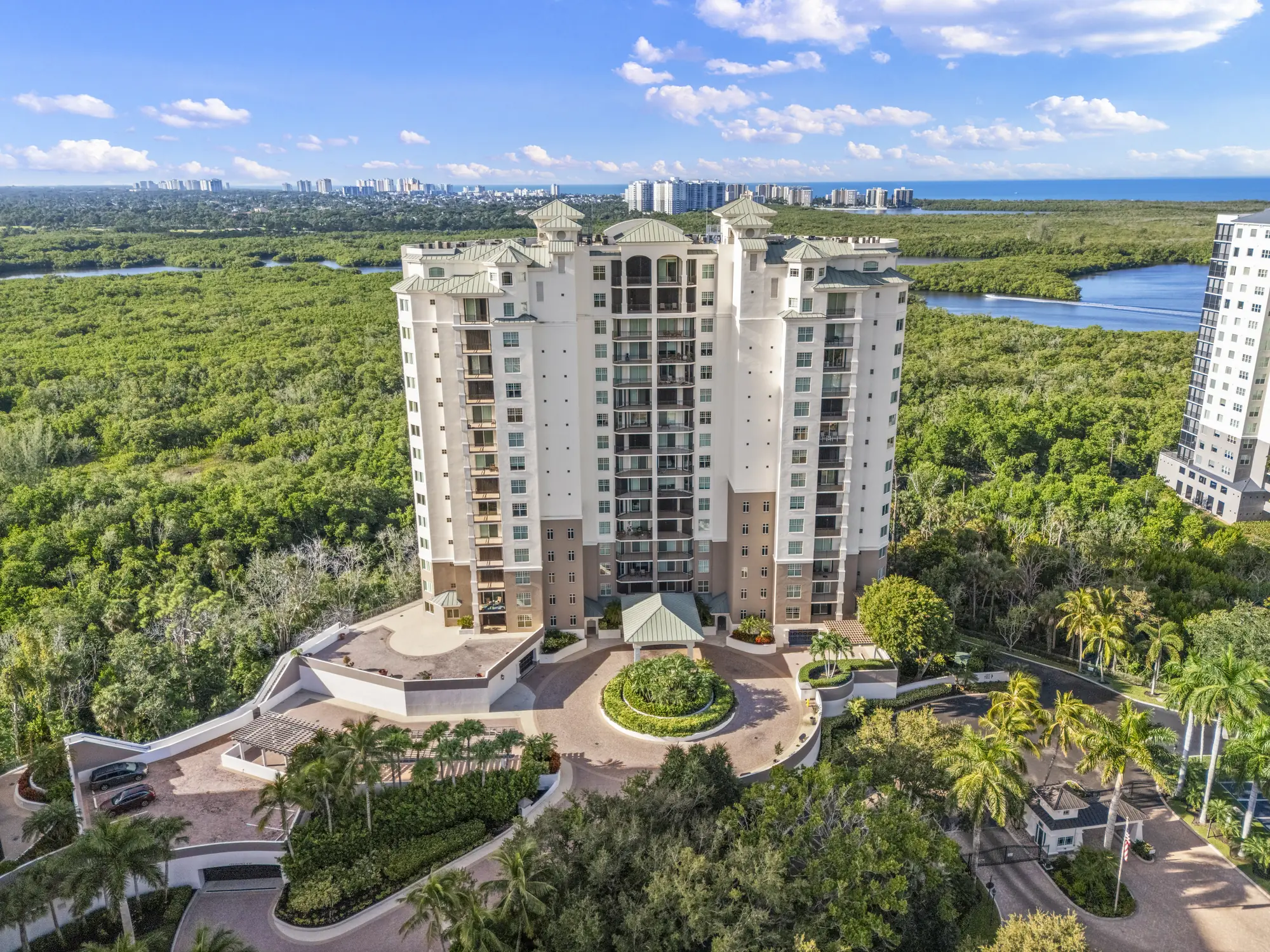 Aerial of Montego at Cove Towers, 445 Cove Tower Drive, a high-rise above the mangrove preserve in North Naples, Florida