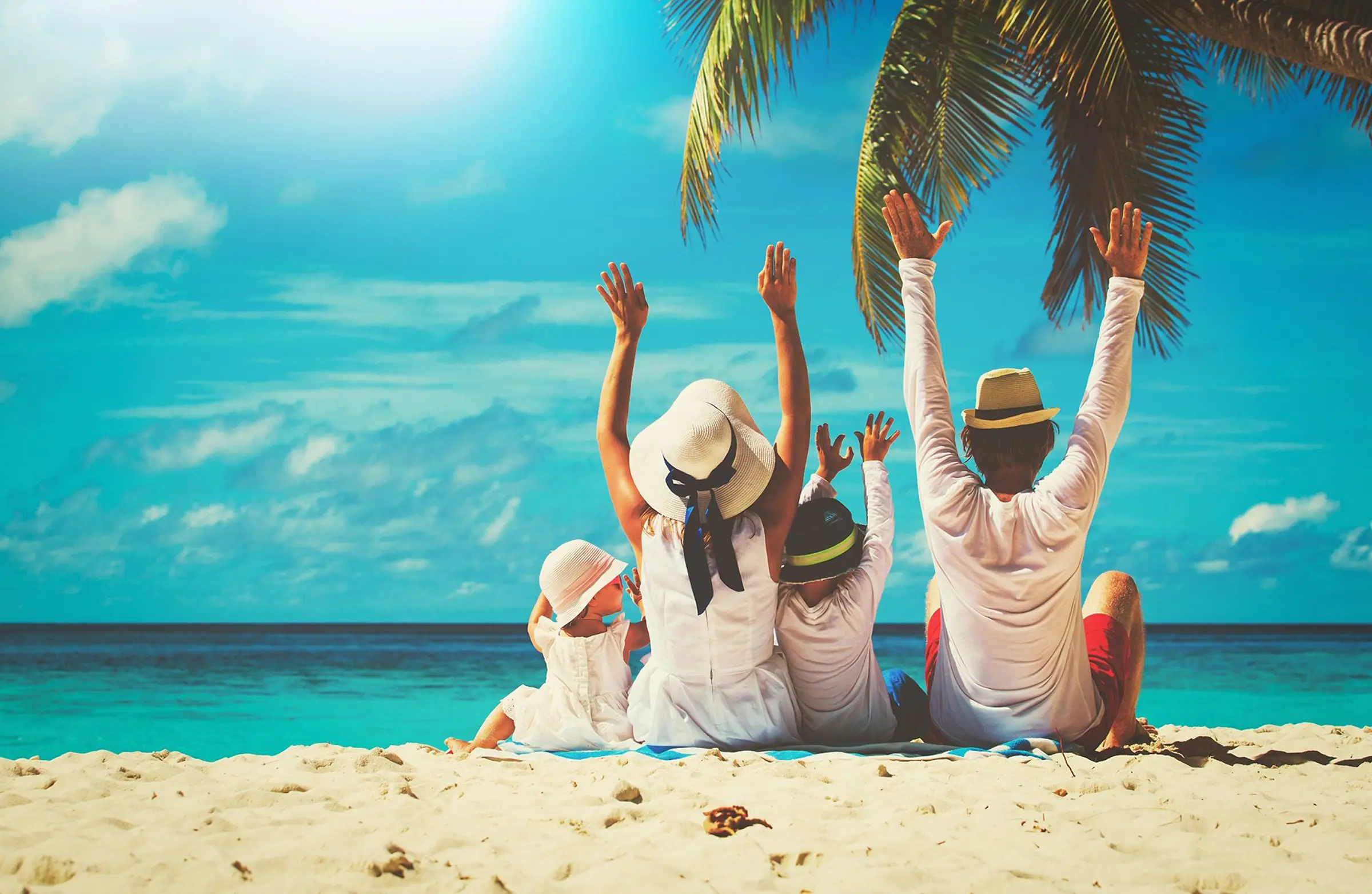 Naples family vacation rentals — family enjoying the beach on the Gulf of Mexico