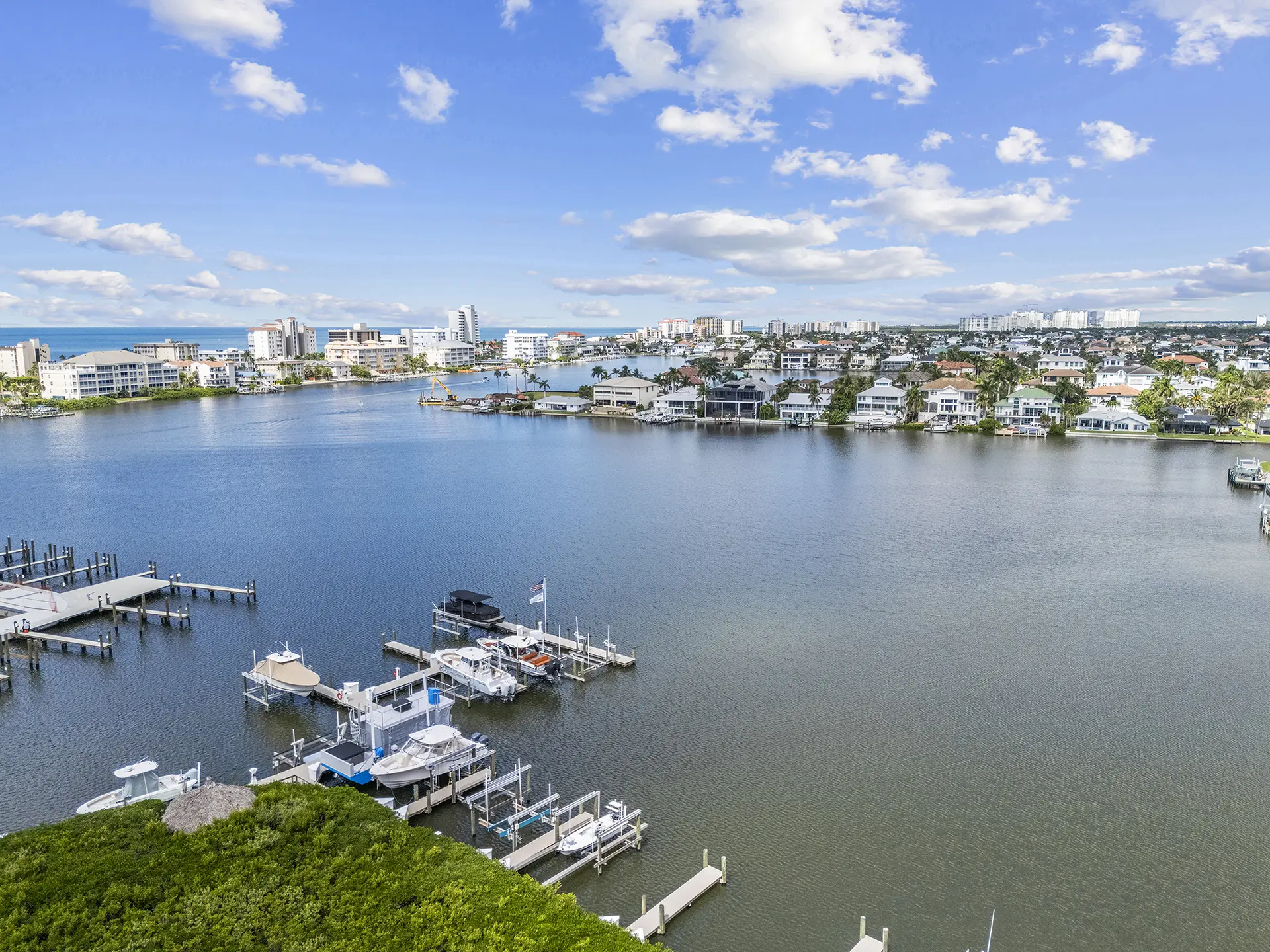 Vanderbilt Lagoon and the Regatta marina docks seen from a residence lanai — Naples, Florida