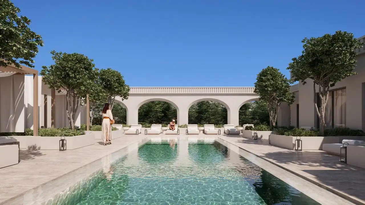 The Avenue Naples — resort-style pool deck with classical arched architecture, Naples Florida