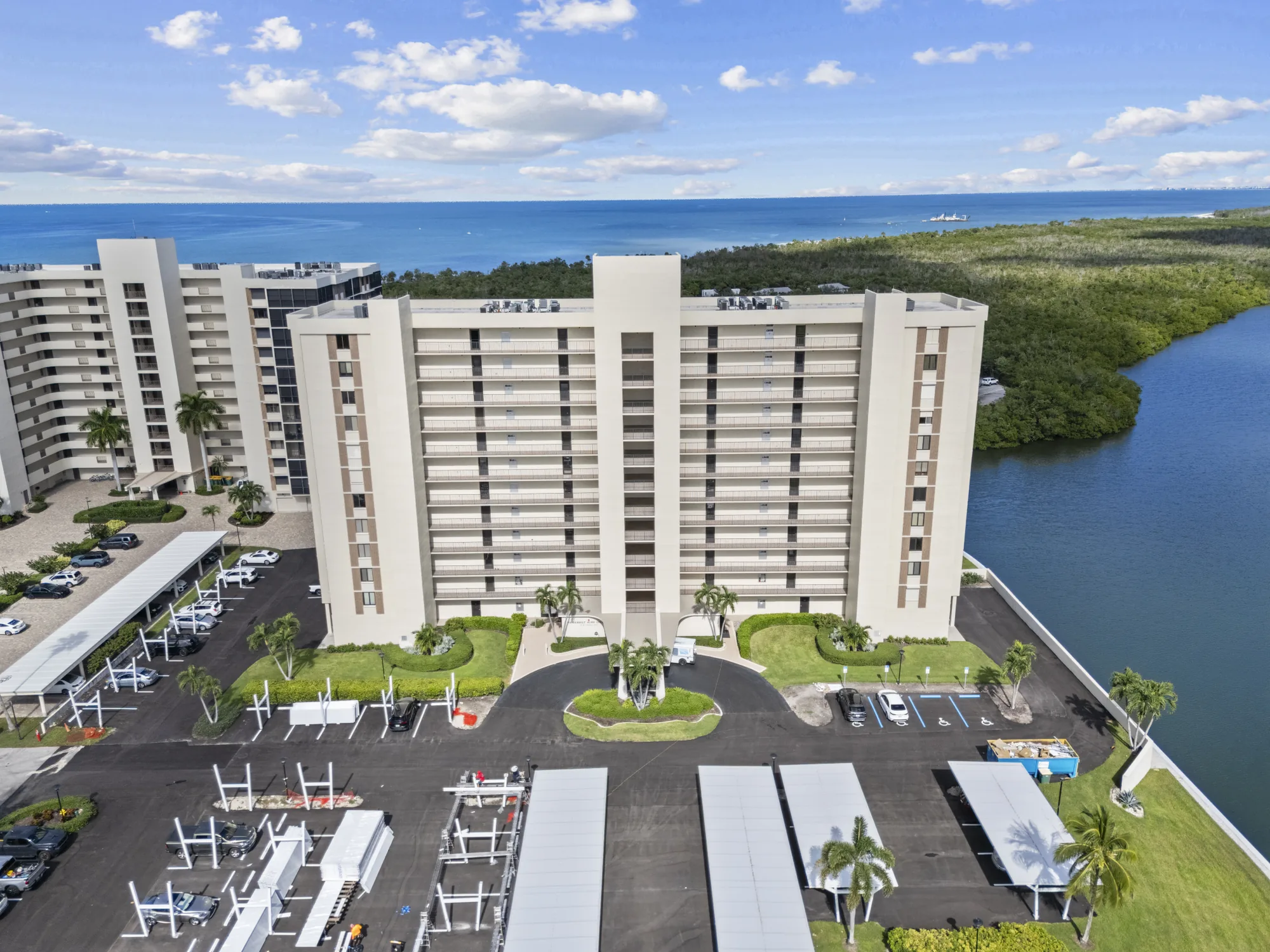Aerial of Surf Colony III at 17 Bluebill Avenue on the bay, with Surf Colony II and the Gulf of Mexico beyond, Vanderbilt Surf Colony, Vanderbilt Beach, Naples, Florida