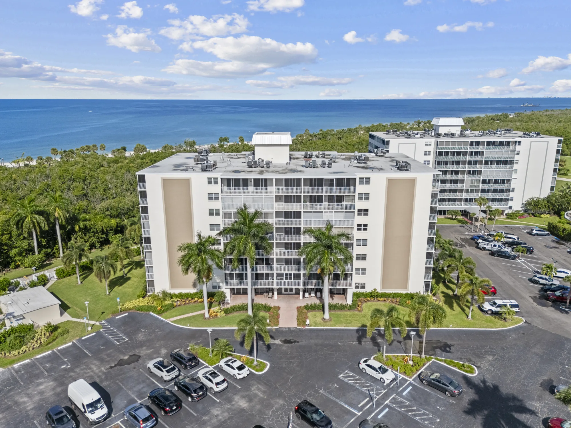 Aerial of the Vanderbilt Towers building at 3 Bluebill Avenue, with another Vanderbilt Towers building, Delnor-Wiggins Pass State Park and the Gulf of Mexico beyond, Vanderbilt Beach, Naples, Florida